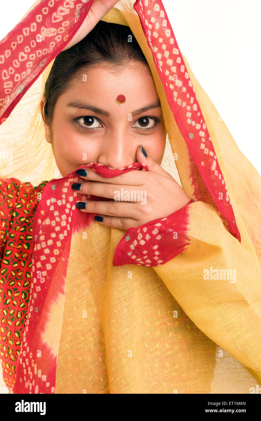 Portrait of Maharashtrian girl covering her mouth with odhni Pune Maharashtra India Asia MR # 686EE Stock Photo