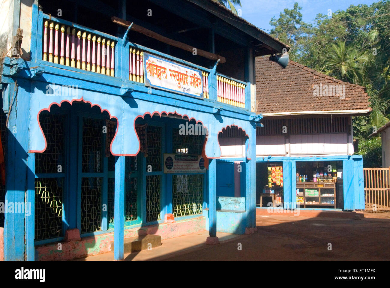 Shree Vitthal Mandir and grocery shop at Anjarle village at district Dapoli ; Maharashtra ; India Stock Photo
