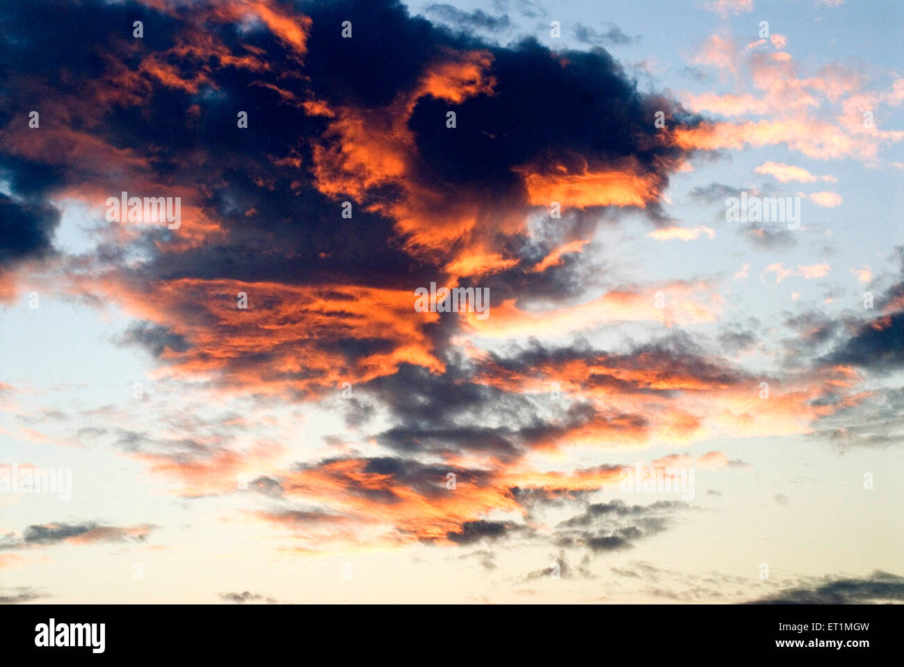 dramatic blue sky red cloud black clouds Stock Photo