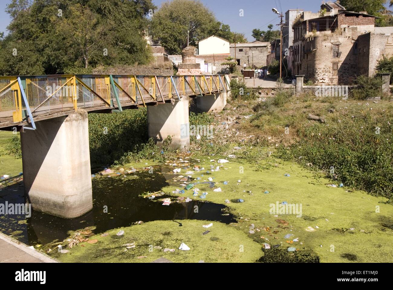 Pollution river turns into garbage dump people throw rubbish river karh Sasvad village taluka Purandar Pune maharashtra india Stock Photo