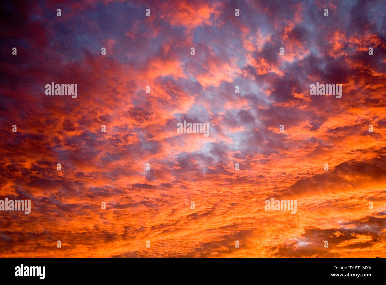 orange sky yellow red clouds sunrise dawn morning Stock Photo