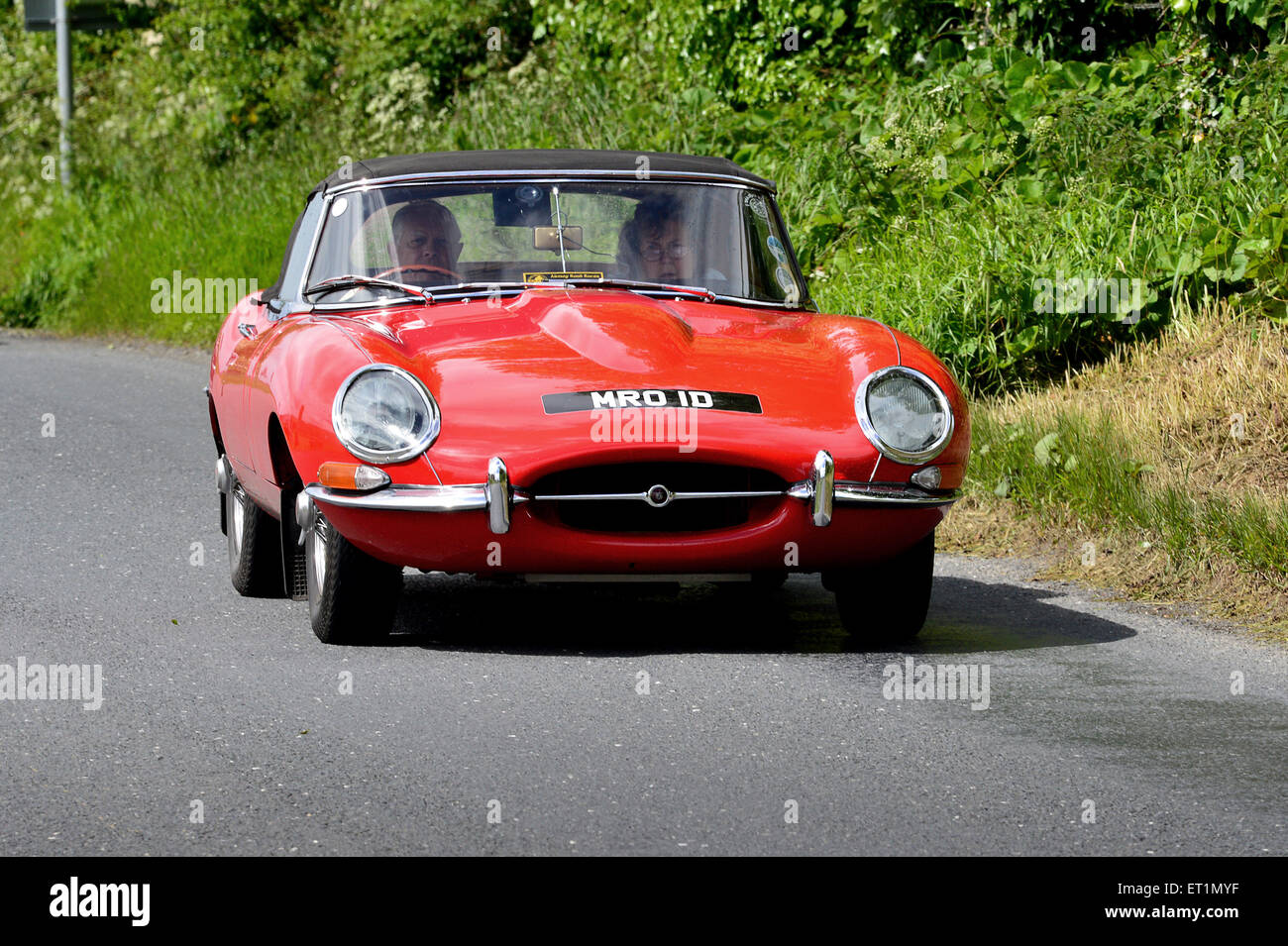 1960s Jaguar E-Type classic red sports car on country road, Burnfoot, County Donegal, Ireland Stock Photo