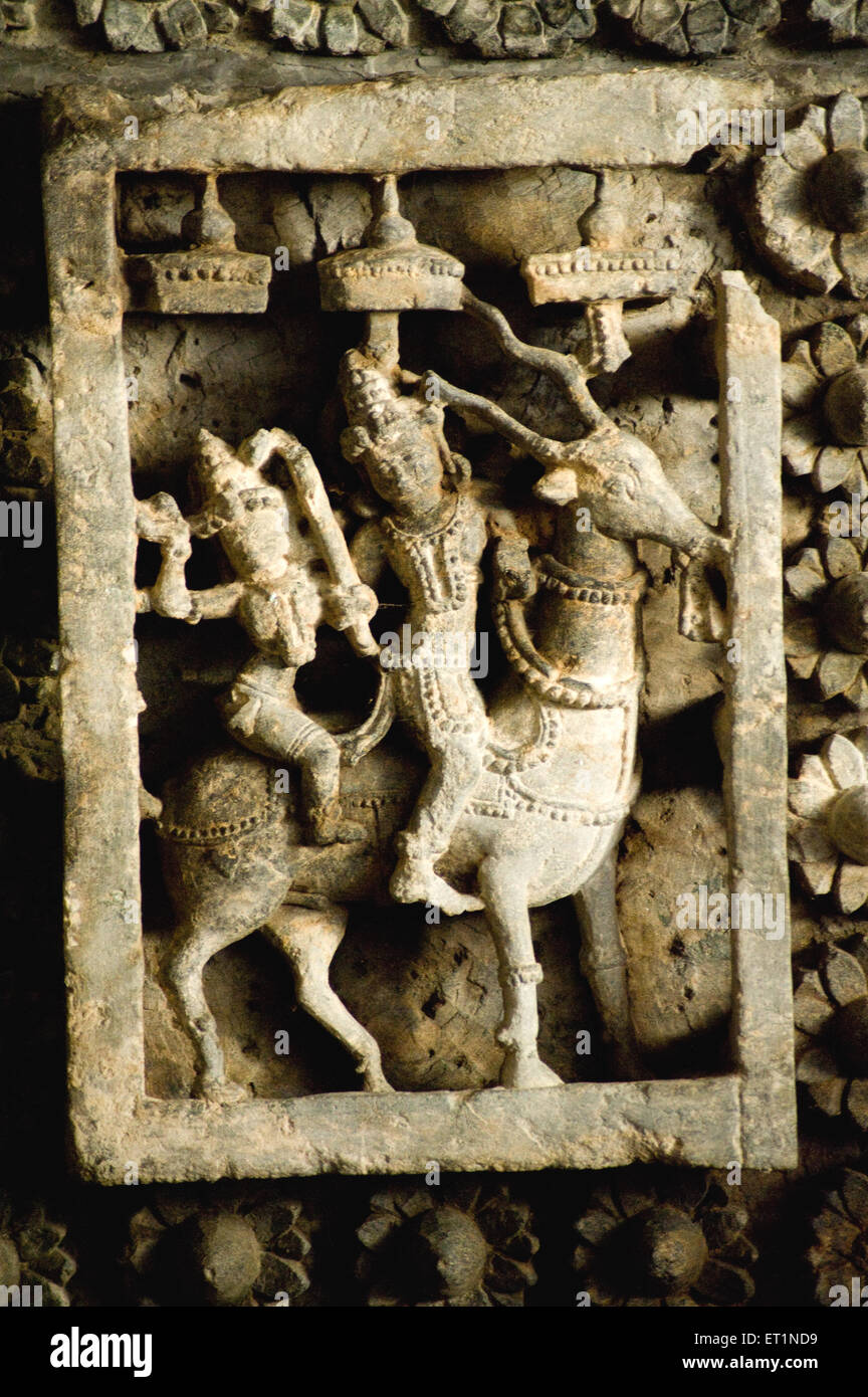 Statues of god and goddess mounted on antelope in garbhagruhas of hoysaleswara temple ; Halebid Halebidu Karnataka Stock Photo