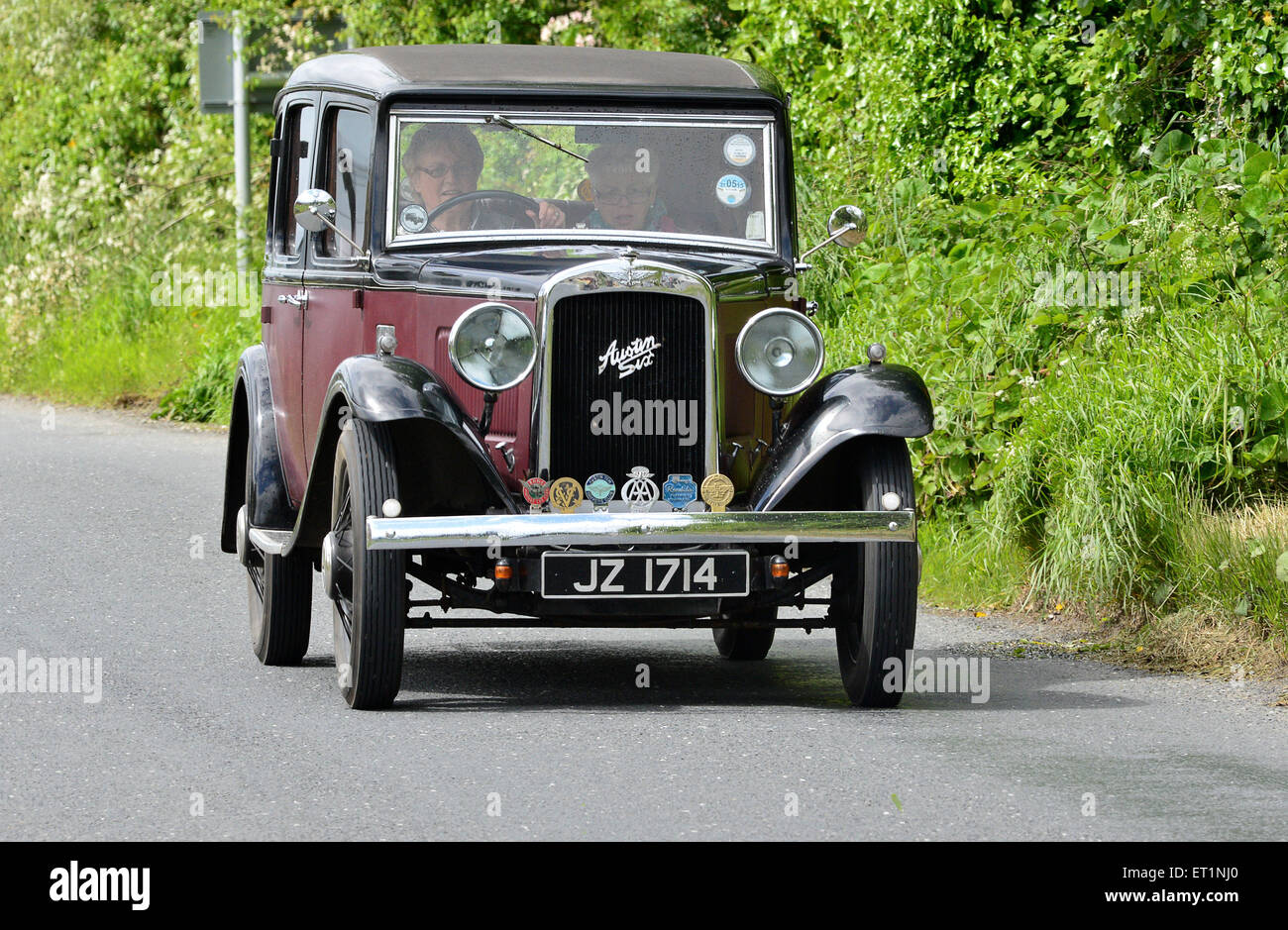1930s Red Austin Six saloon classic car on country road, Burnfoot, County Donegal, Ireland Stock Photo