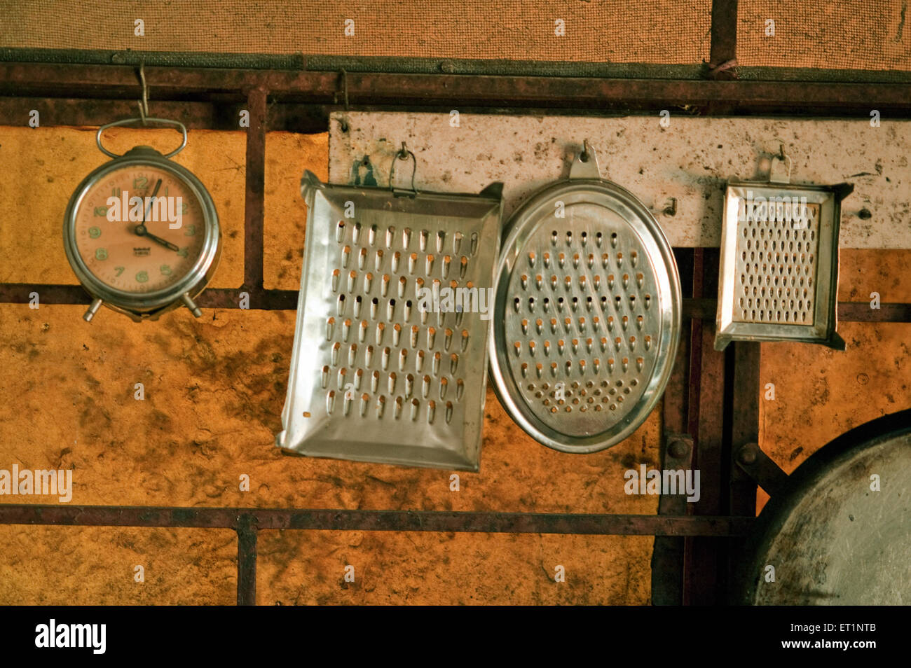 Grater and pans in kitchen Stock Photo