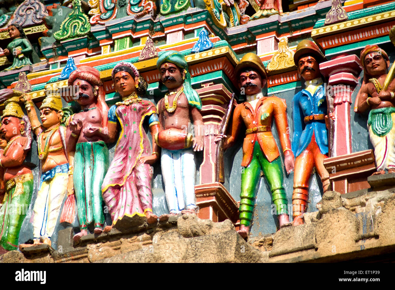 Richly painted stucco figures on gopuram of vishnu alagar kovil temple near Madurai ; Tamil Nadu India Stock Photo