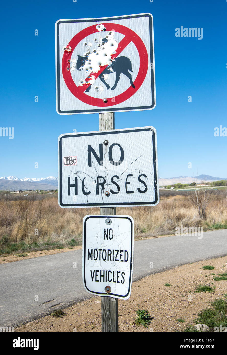 Sign vandalism along the Jordan River Parkway, a green space in Salt Lake County, Utah Stock Photo