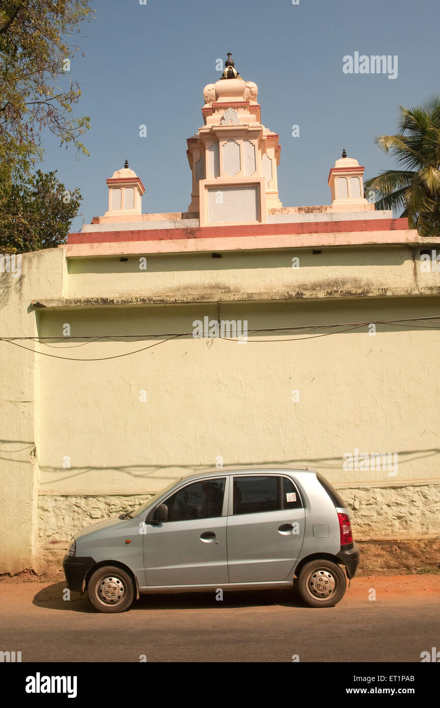 Maruti car parked profile temple wall, Trivandrum, Thiruvananthapuram, Kerala, India, Asia Stock Photo