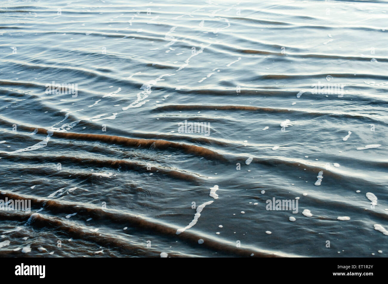 Ripples on sea water at Nagaon beach ; Alibag ; Konkan ; Maharashtra ; India Stock Photo