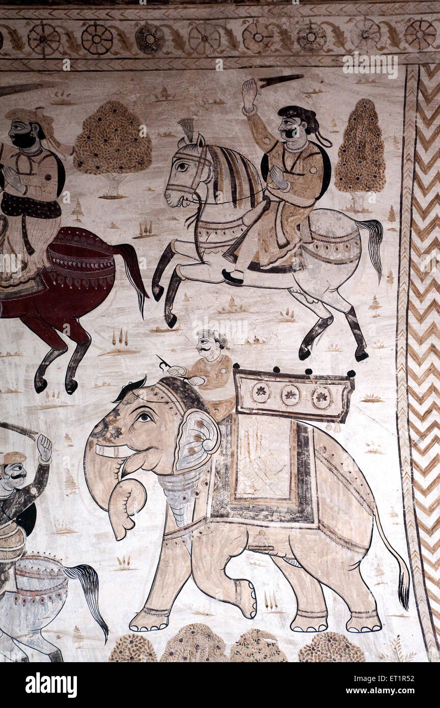 Wall painting mural soldiers on horses and elephants at Lakshminarayan temple ; Orchha ; Tikamgarh ; Madhya Pradesh ; India Stock Photo