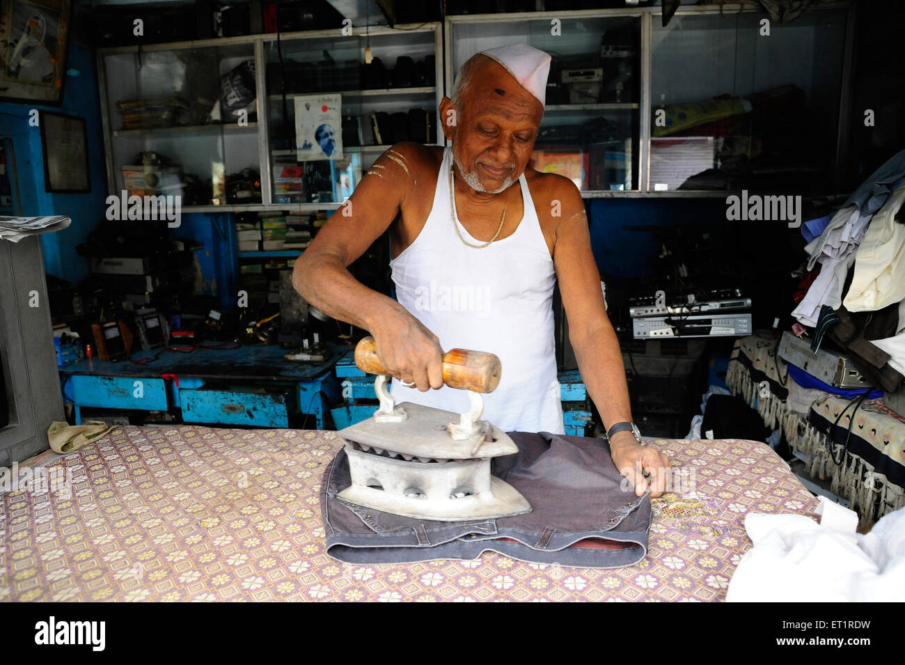 launderer washerman laundryman ironing ; Akluj ; Solapur ; Maharashtra
