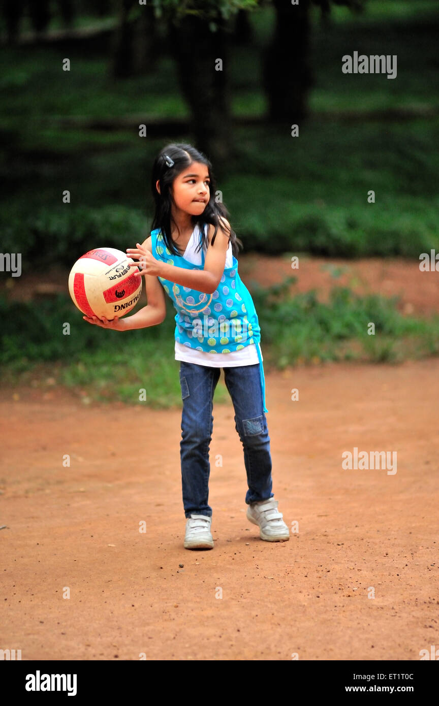 Girl playing with ball in garden MR#556 Stock Photo
