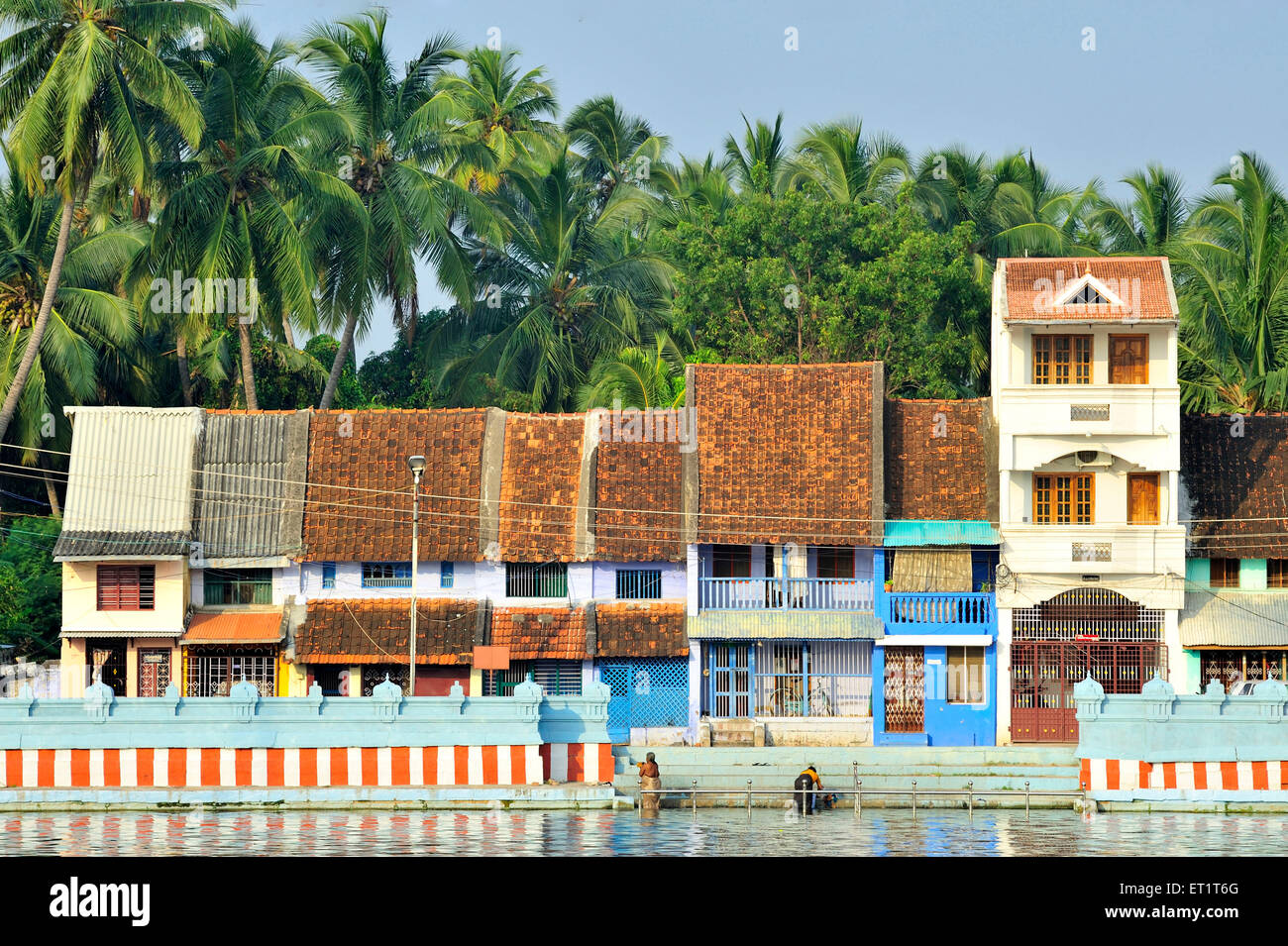 Small houses near tank in suchindram at tamil nadu india Asia Stock Photo