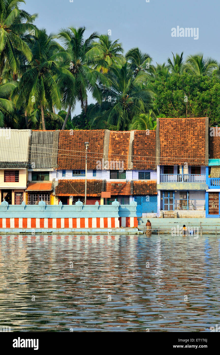 Small houses near tank in suchindram at tamil nadu india Asia Stock Photo