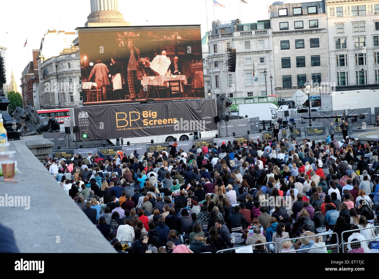 People watch  opera on big screen beamed alive from the Royal Opera House Stock Photo