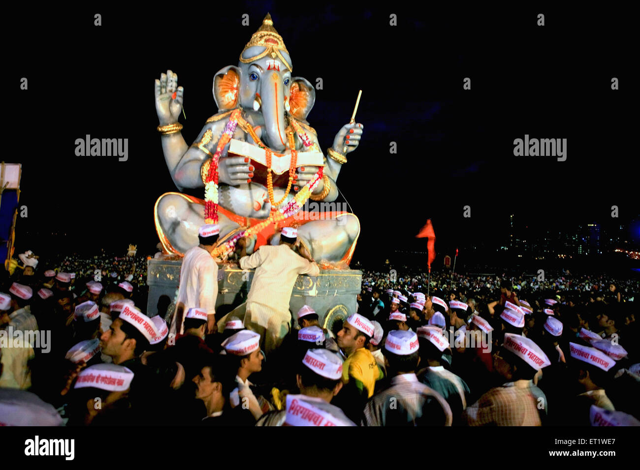 Idol of lord Ganesha (elephant headed god) ; Visarjan ceremony 2008 ; Girgaum Chowpatty beach ; Bombay Mumbai ; Maharashtra Stock Photo
