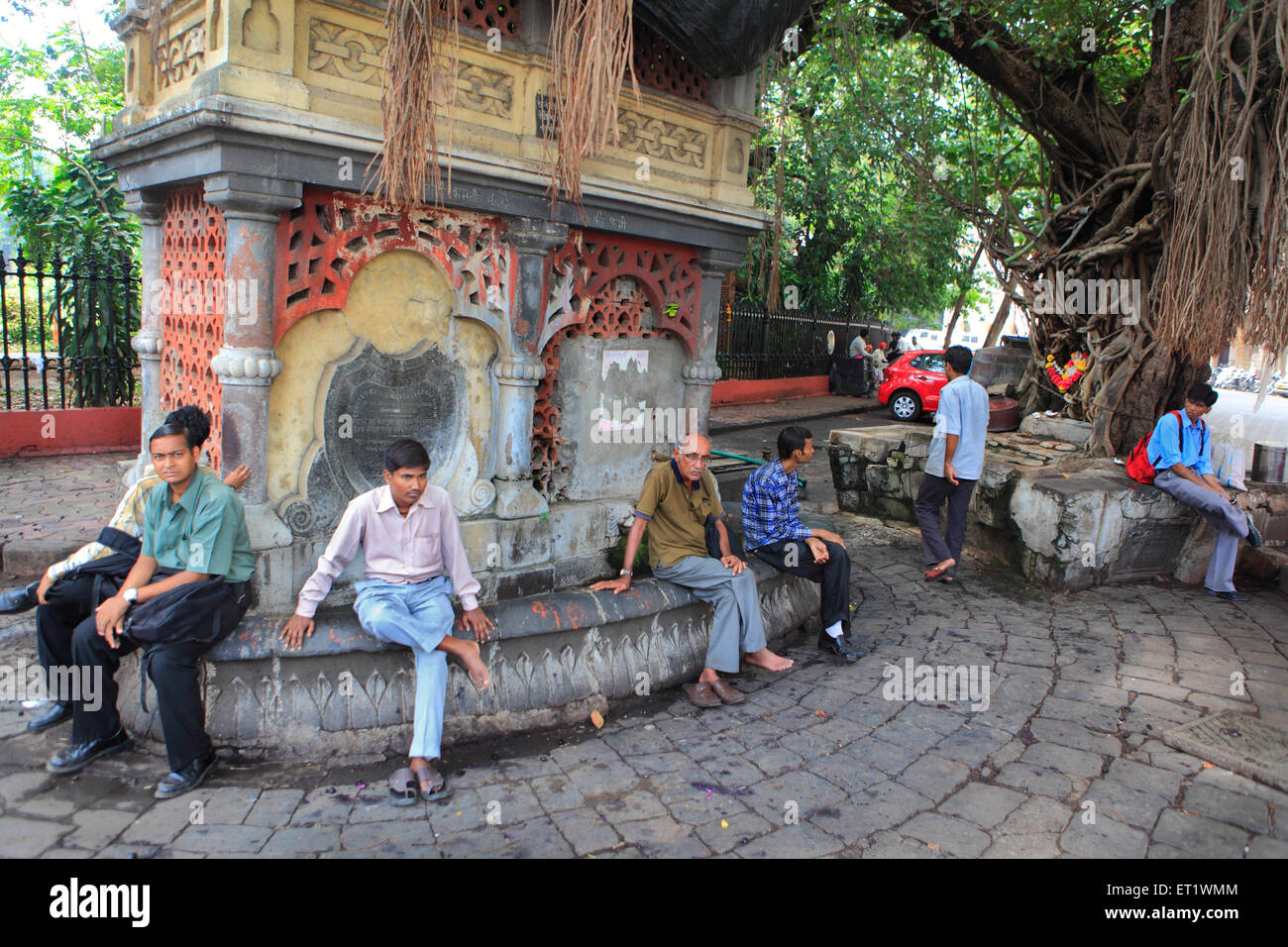 Street scene people sitting relaxing resting Horniman Circle Bombay Mumbai Maharashtra India Asia Stock Photo