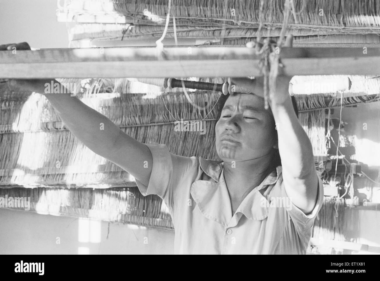 Apa Tani woman at loom ; Arunachal Pradesh ; India NO MR Stock Photo