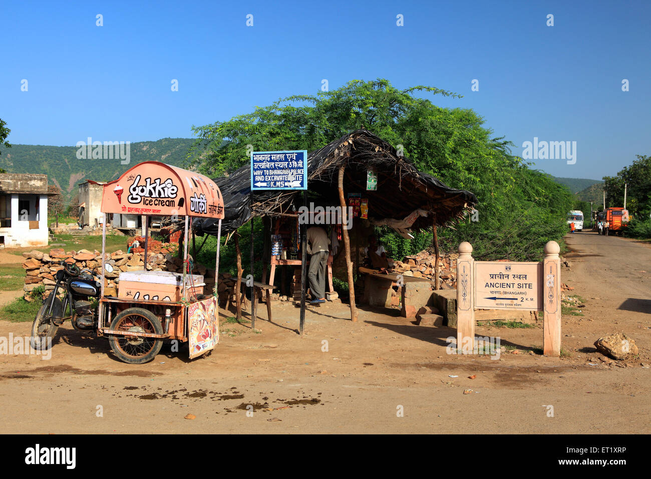 Ancient site signboard ; ice cream vendor bike ; Bhangarh Fort ; Rundh Bhangarh ; Bhangarh ; Rajgarh ; Alwar ; Rajasthan ; India ; Asia Stock Photo