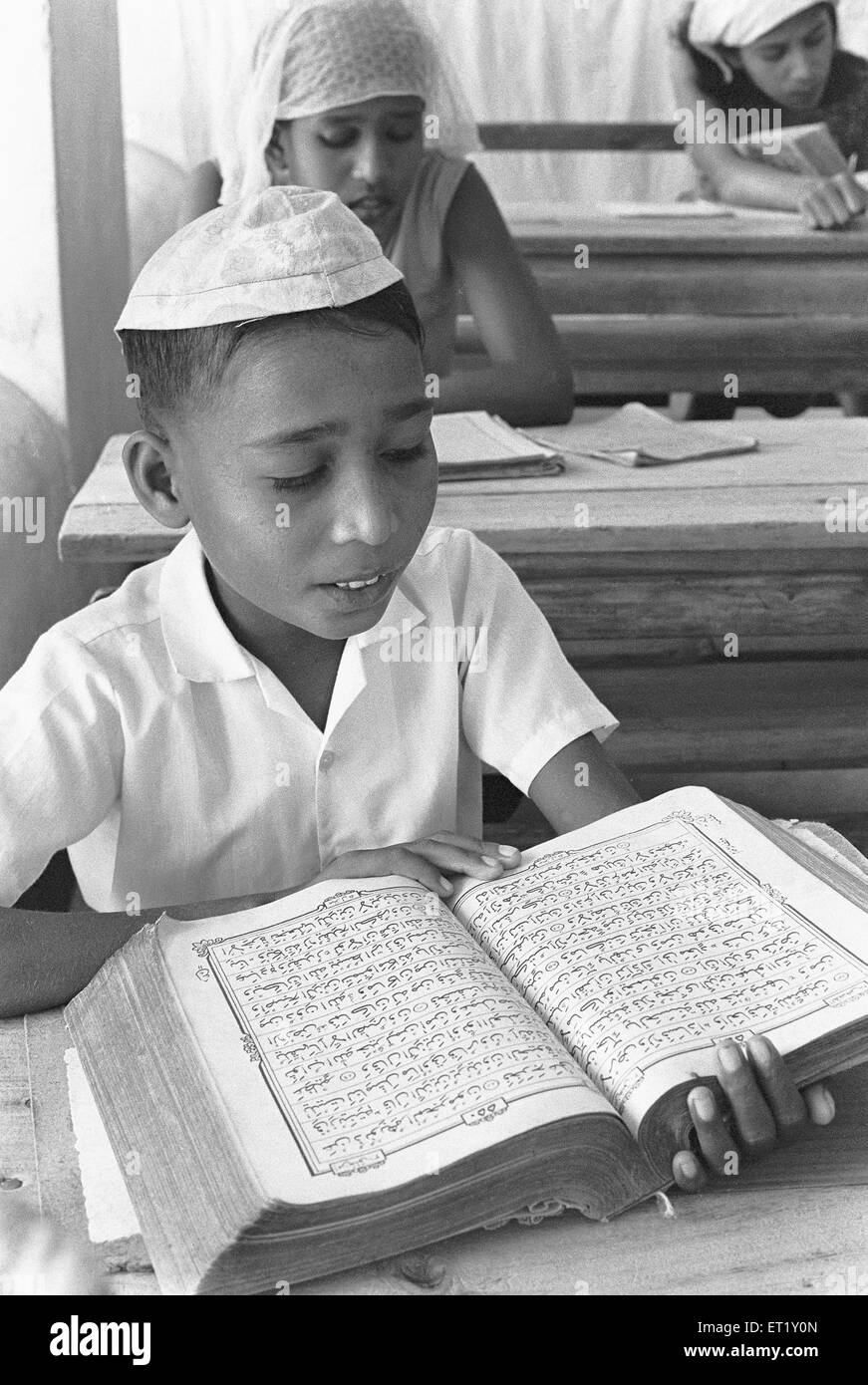Pupil in classroom ; Male ; capital of Maldives, Asia ; old vintage 1900s Stock Photo