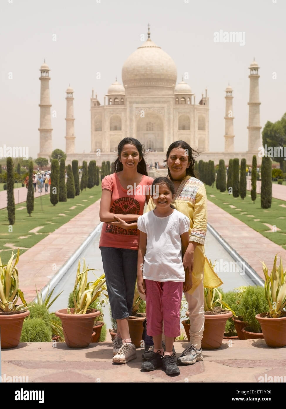 Mother and children standing at Taj Mahal Agra India MR#477 Stock Photo