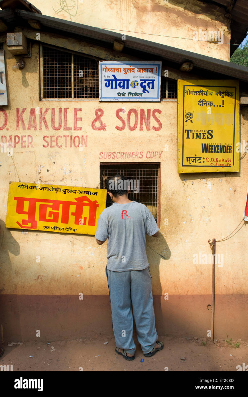 Man buying newspaper, Panjim, Panaji, Goa, India, Asia Stock Photo