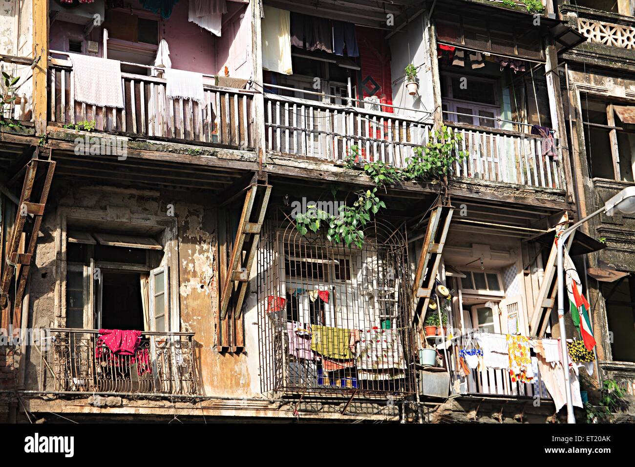 Old chawl Mapla Mahal mass urban housing ; Girgaon ; Jagannath Shankarsheth Road ; Charni Road ; Bombay Mumbai Stock Photo