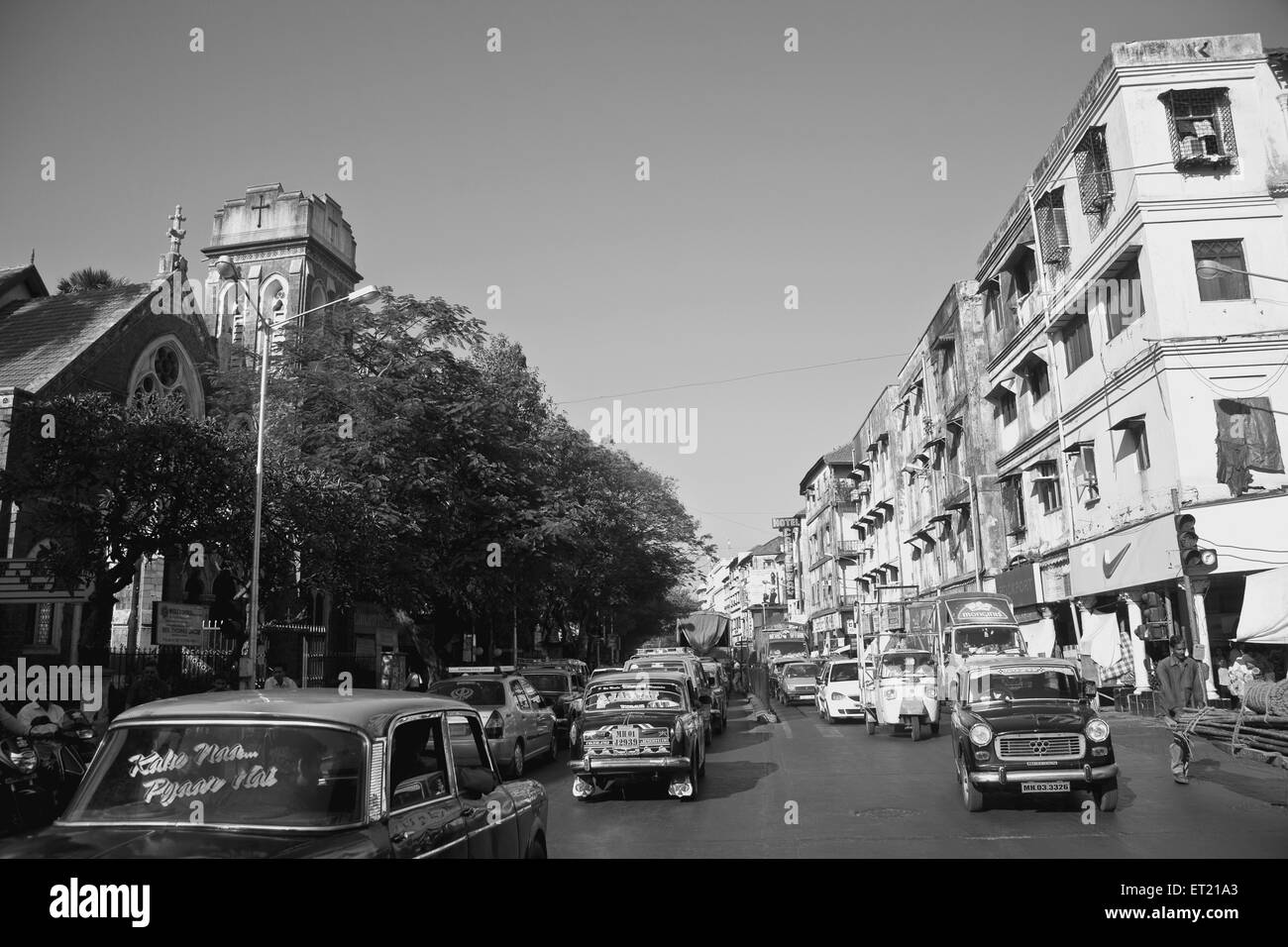 Old building and Wesley at shahid bhagat sing marg ; colaba causeway road ; Bombay Mumbai ; Maharashtra ; India 31 December 2009 Stock Photo