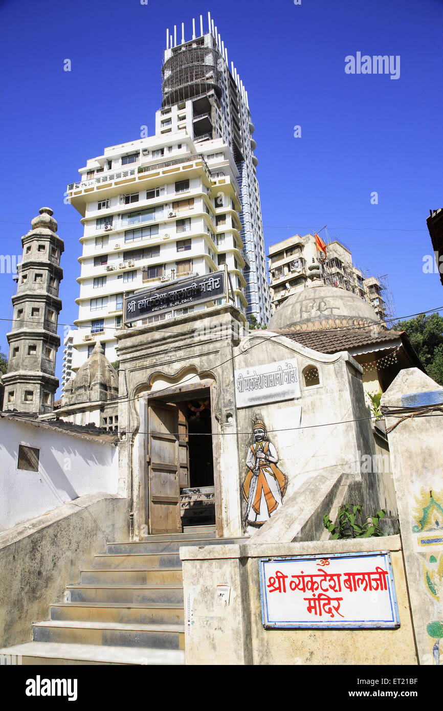 Shree vyanktesh balaji temple and skyscraper ; Banganga ; Walkeshwar ; Bombay Mumbai ; Maharashtra ; India 9 April 2009 Stock Photo