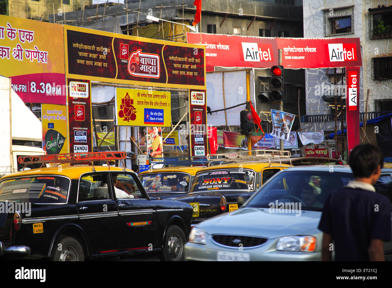 Advertising hoardings and traffic ; Sakharam Balaji Pawar Marg ; Curry Road ; Bombay Mumbai ; Maharashtra ; India 26 August 2009 Stock Photo