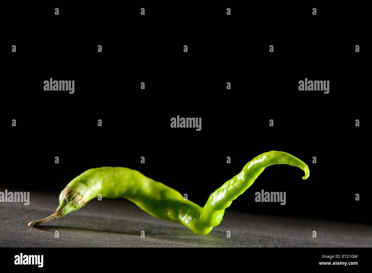 Chili pepper, green chilli, black background Stock Photo