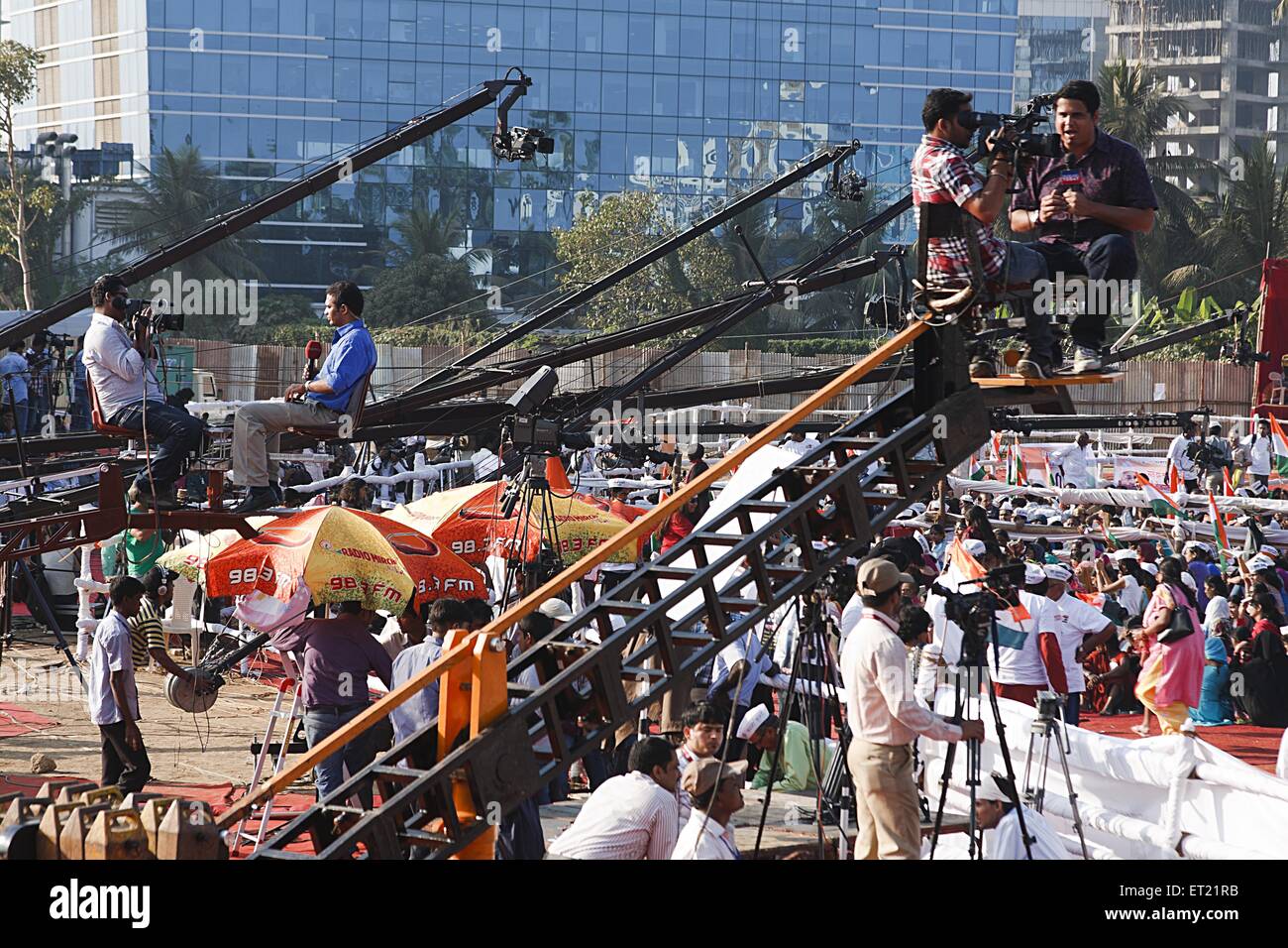 Video Camera and Reporter Mounted on Crane Coverage Mumbai Maharashtra India Asia Dec 2011 Stock Photo
