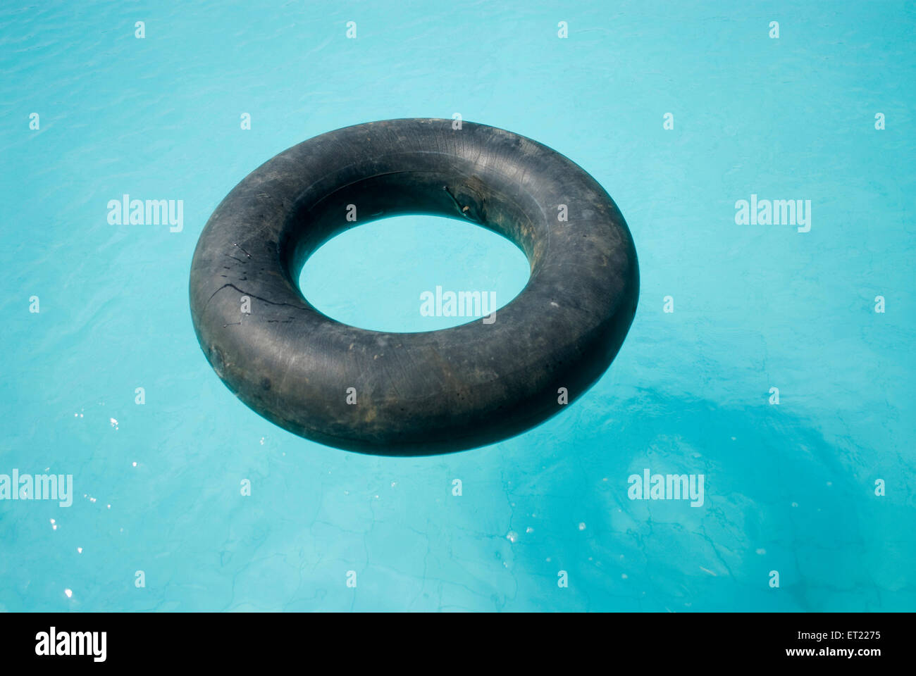 Inflated tire tube in swimming pool, Anjar, Kutch, Kachchh, Gujarat, India, Asia Stock Photo