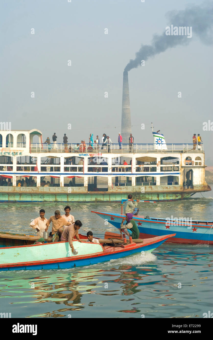 Boats and ferry going across river Padma ; Bangladesh Stock Photo
