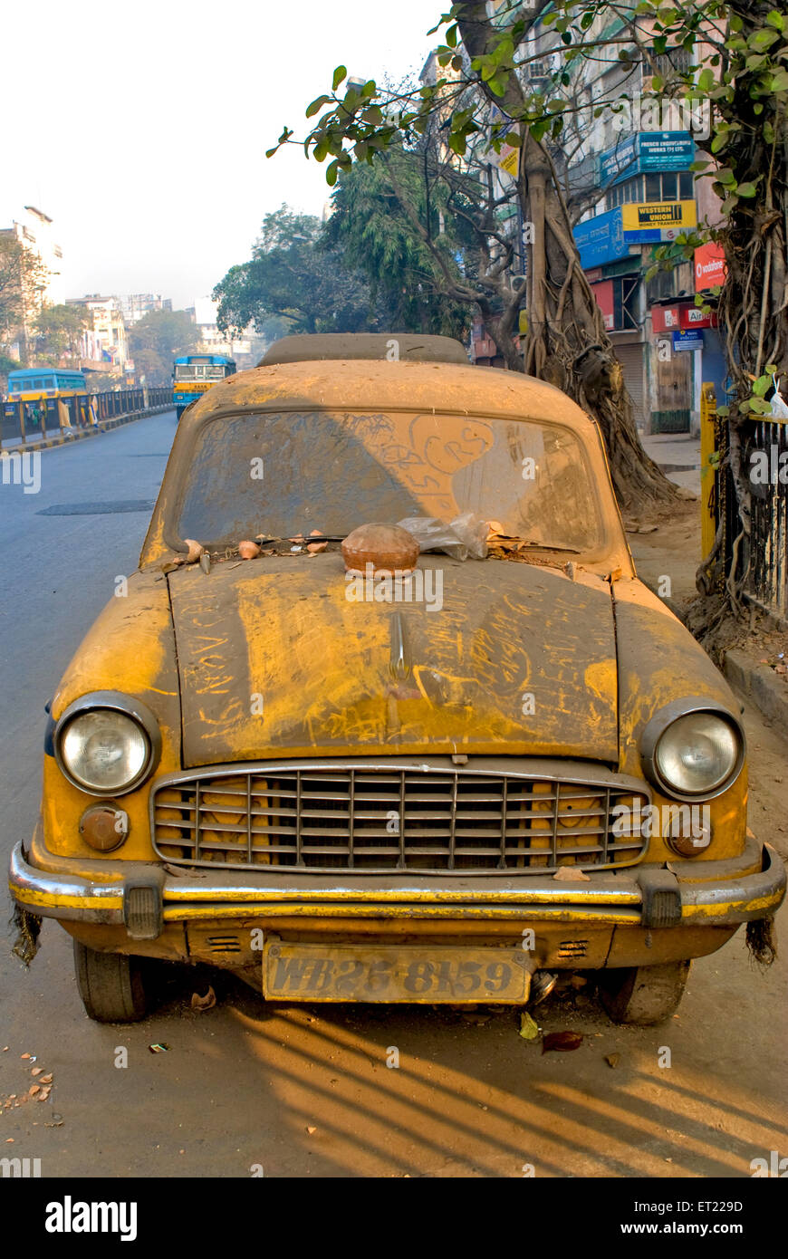 Old unused discarded covered with dust taxi Bhowanipur Calcutta Kolkata West Bengal India Stock Photo