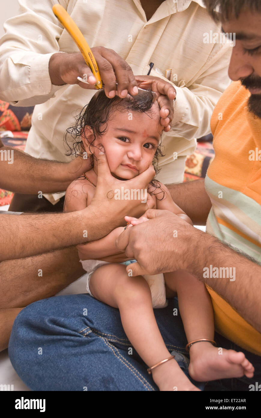Tonsure baby boy receives hindu rite MR#714H Stock Photo