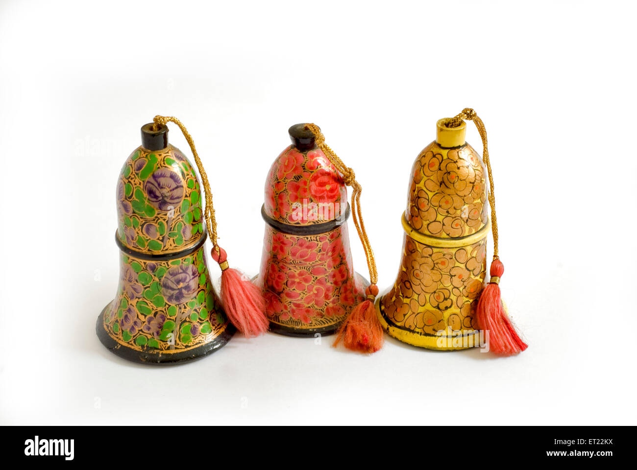 Three paper mache bells handicraft ; Papier mache on white background ; Srinagar ; Jammu and Kashmir ; India ; Asia Stock Photo