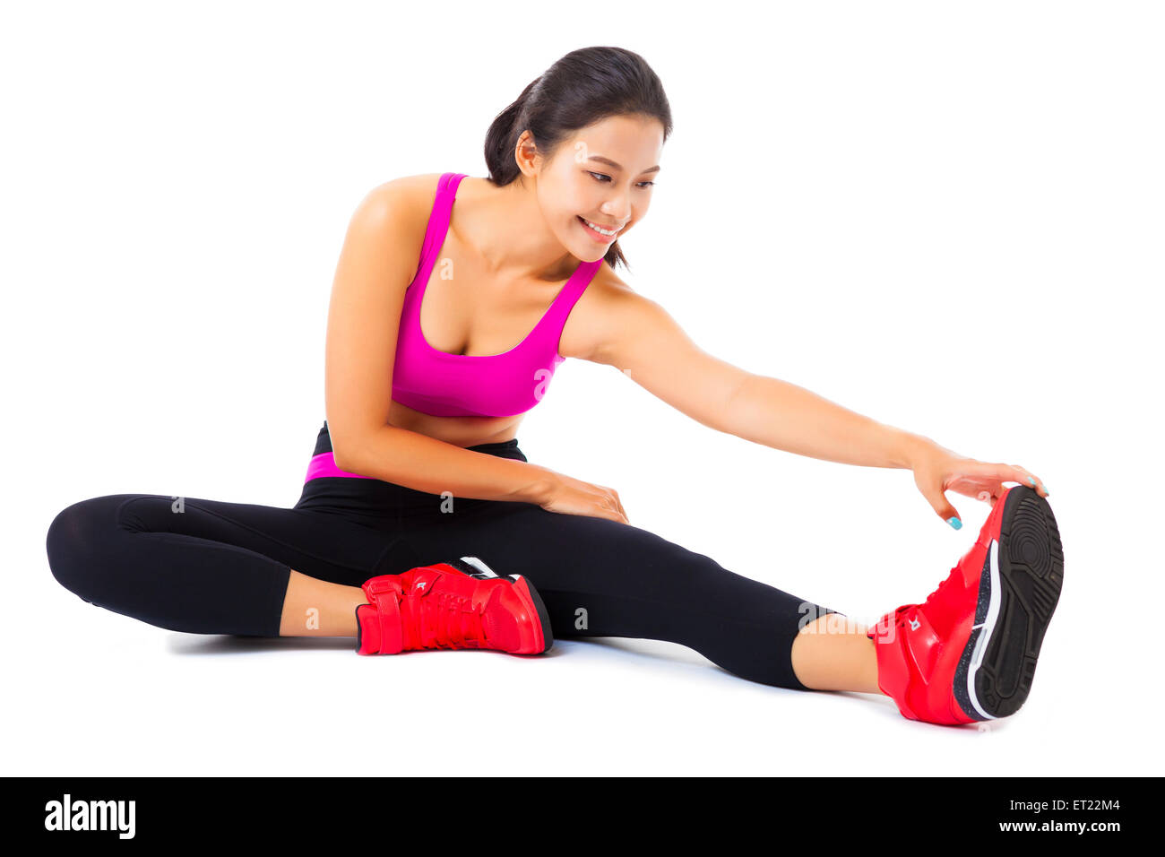 beautiful young woman stretching on the floor Stock Photo - Alamy