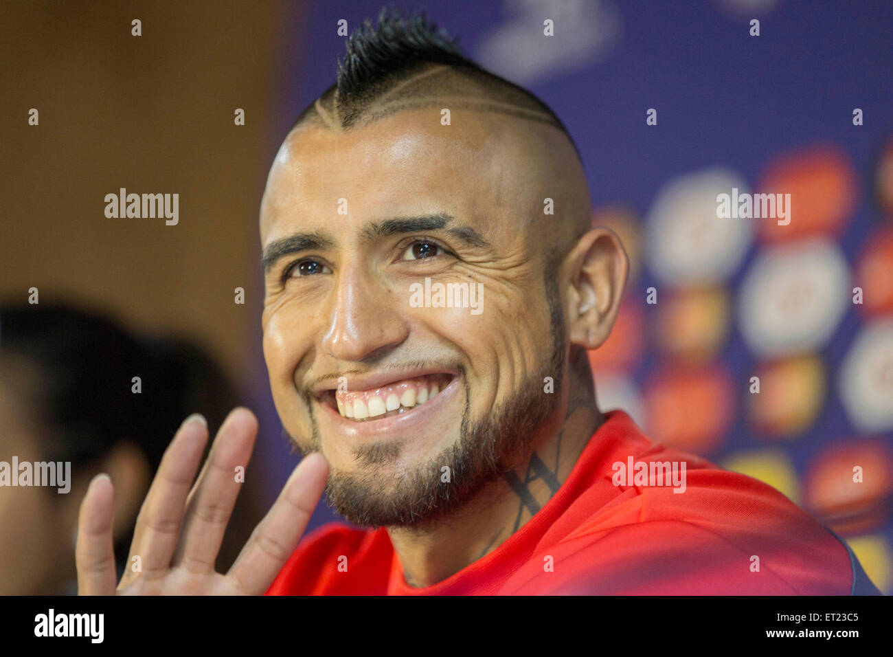 Santiago, Chile. 10th June, 2015. Chile's national soccer team player Arturo Vidal reacts during a press conference prior to the opening match of the 2015 Copa America agaisnt Ecuador, in the city of Santiago, capital of Chile, on June 10, 2015. The 2015 Copa America will be held in Chile from June 11 to July 4. Credit:  Luis Echeverria/Xinhua/Alamy Live News Stock Photo