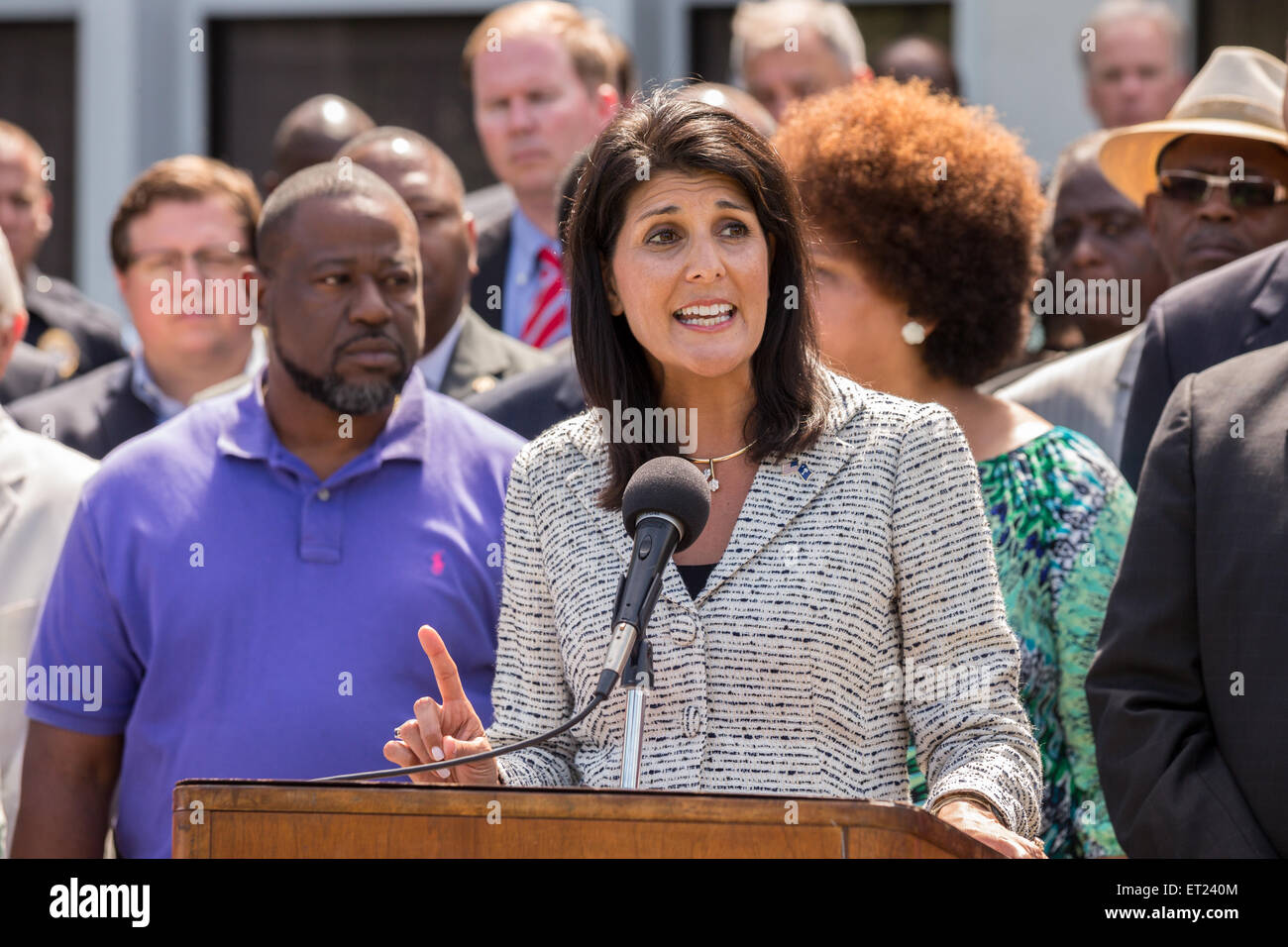 South Carolina Governor Nikki Haley joined by local politicians and the Scott family speaks before signing the first bill in the nation requiring all police to wear video cameras on June 10, 2015 in North Charleston, South Carolina. The bill was a result of the killing of Walter Scott by a police officer in North Charleston in April. Stock Photo