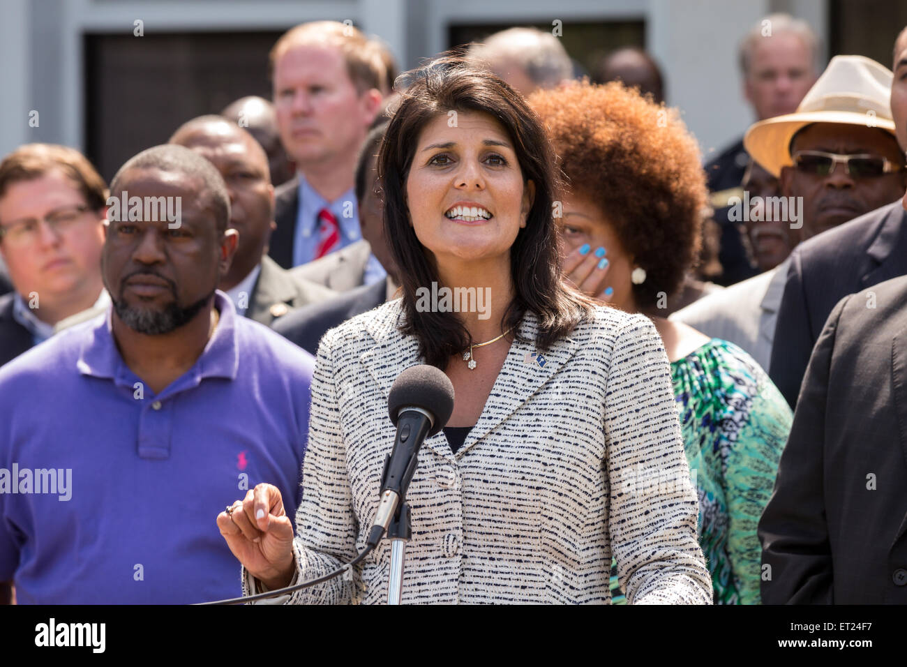 South Carolina Governor Nikki Haley joined by local politicians and the Scott family speaks before signing the first bill in the nation requiring all police to wear video cameras on June 10, 2015 in North Charleston, South Carolina. The bill was a result of the killing of Walter Scott by a police officer in North Charleston in April. Stock Photo