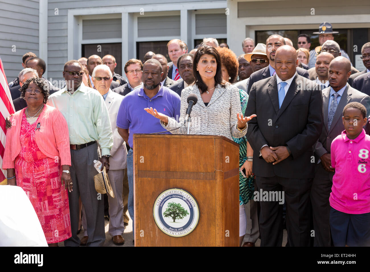 South Carolina Governor Nikki Haley joined by local politicians and the Scott family speaks before signing the first bill in the nation requiring all police to wear video cameras on June 10, 2015 in North Charleston, South Carolina. The bill was a result of the killing of Walter Scott by a police officer in North Charleston in April. Stock Photo