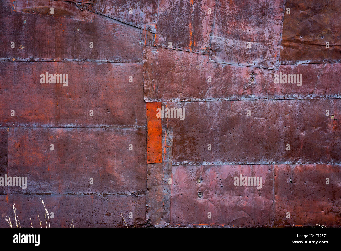 Pounded tin siding on a rusted shed Stock Photo Alamy