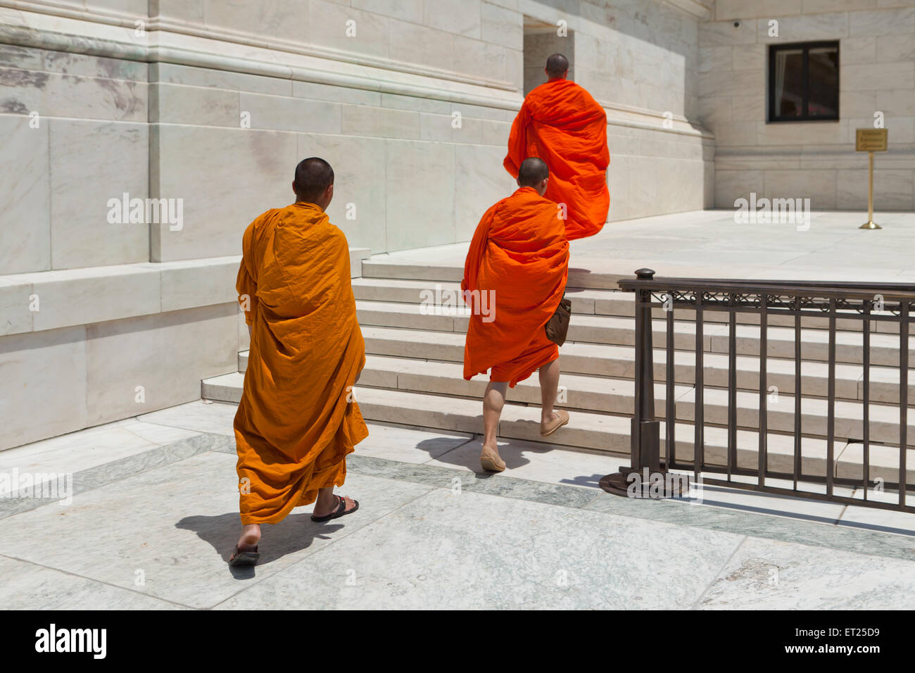 Buddhist monks walking toward the US Supreme Court building - Washington, DC USA Stock Photo