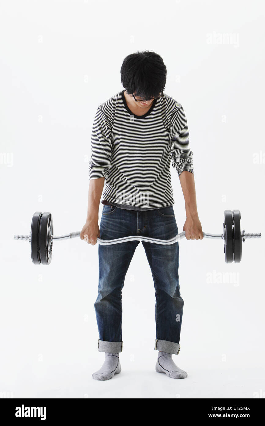 Young Man Doing Physical Exercise Stock Photo
