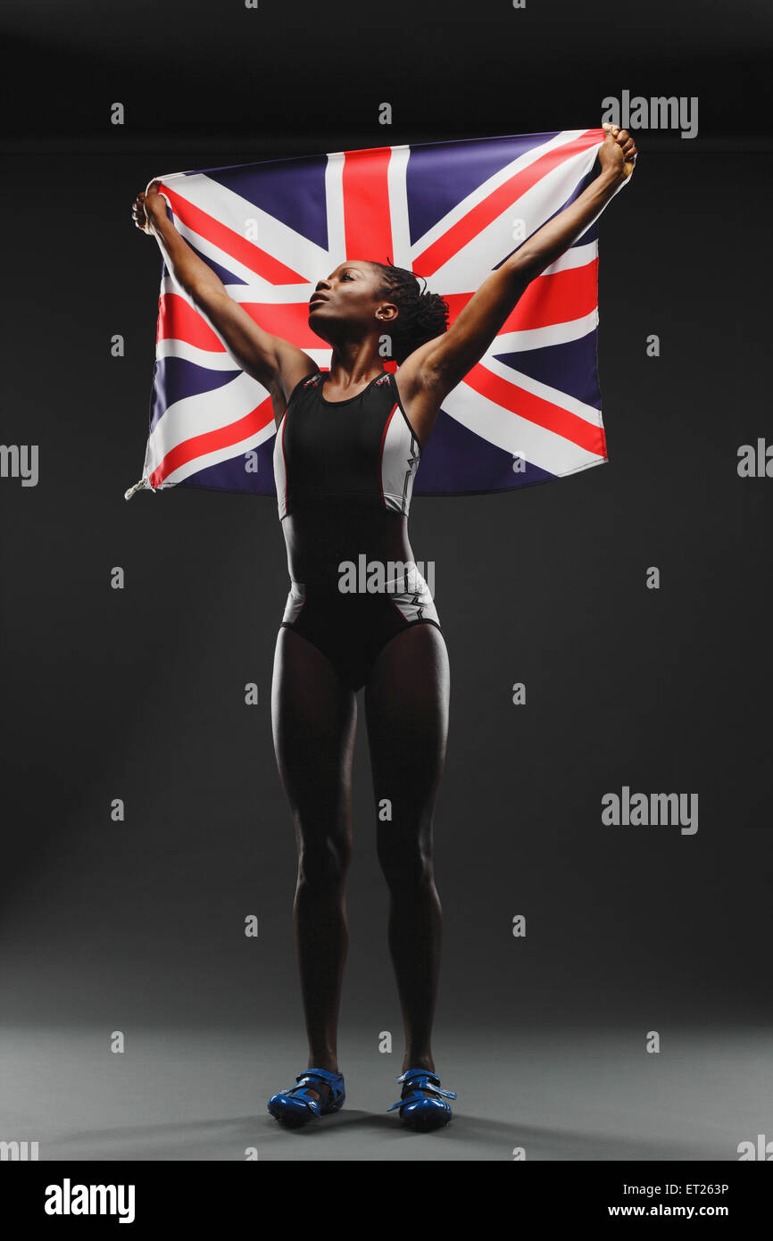 Female Athlete Holding a British Flag Stock Photo