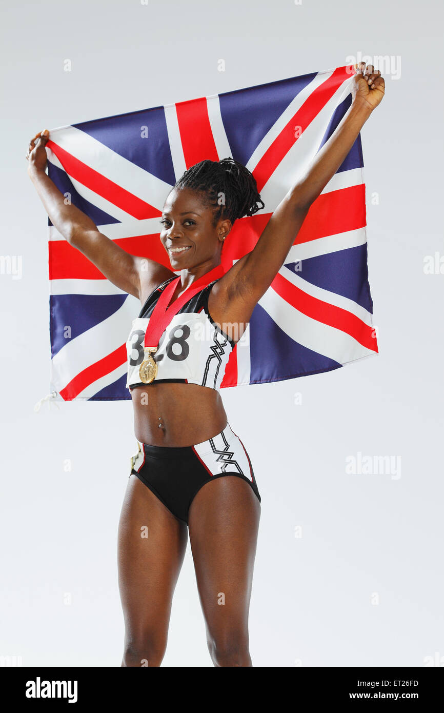 Female Athlete Holding a British Flag Stock Photo