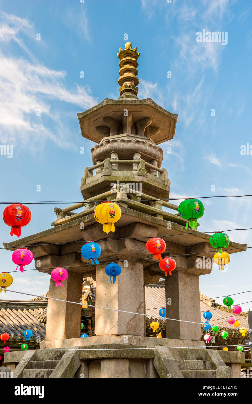 Colorful paper lanterns hang around a stone pagoda at Bulguksa Temple in Gyeongju, South Korea, during Buddha's Birthday. Stock Photo