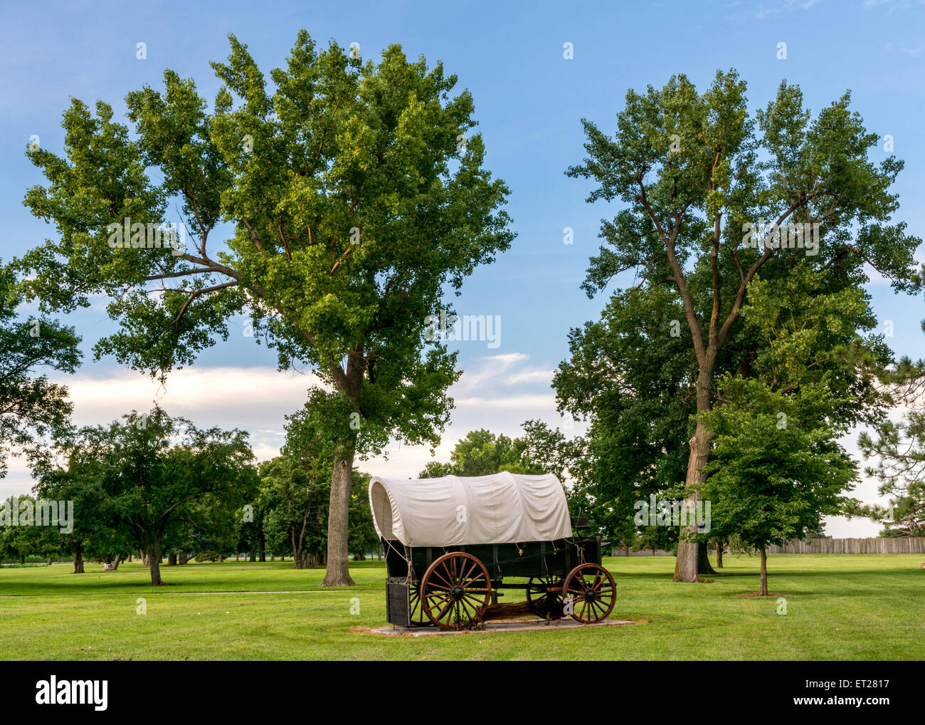 Western covered wagon parked in a park Stock Photo Alamy
