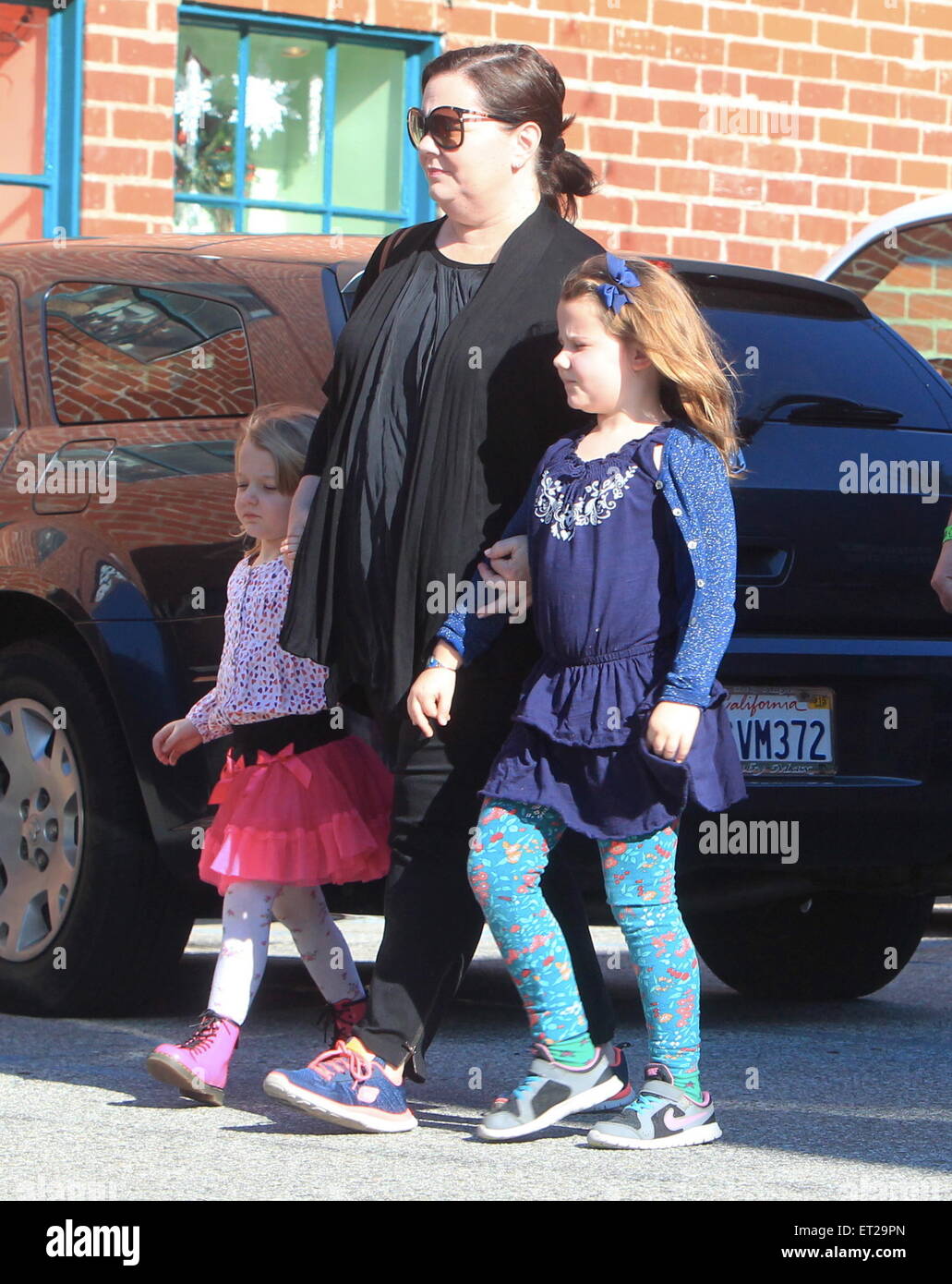 Melissa McCarthy and husband Ben Falcone take their daughters Vivian and  Georgette to a birthday party at Pickwick Bowling Alley Featuring: Melissa  McCarthy,Vivian Falcone,Georgette Falcone Where: Burbank, California,  United States When: 06